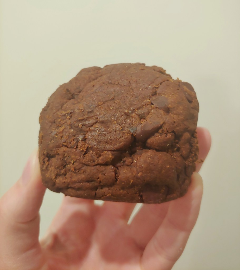 Close-up of a double choc chip cookie by The C Word
