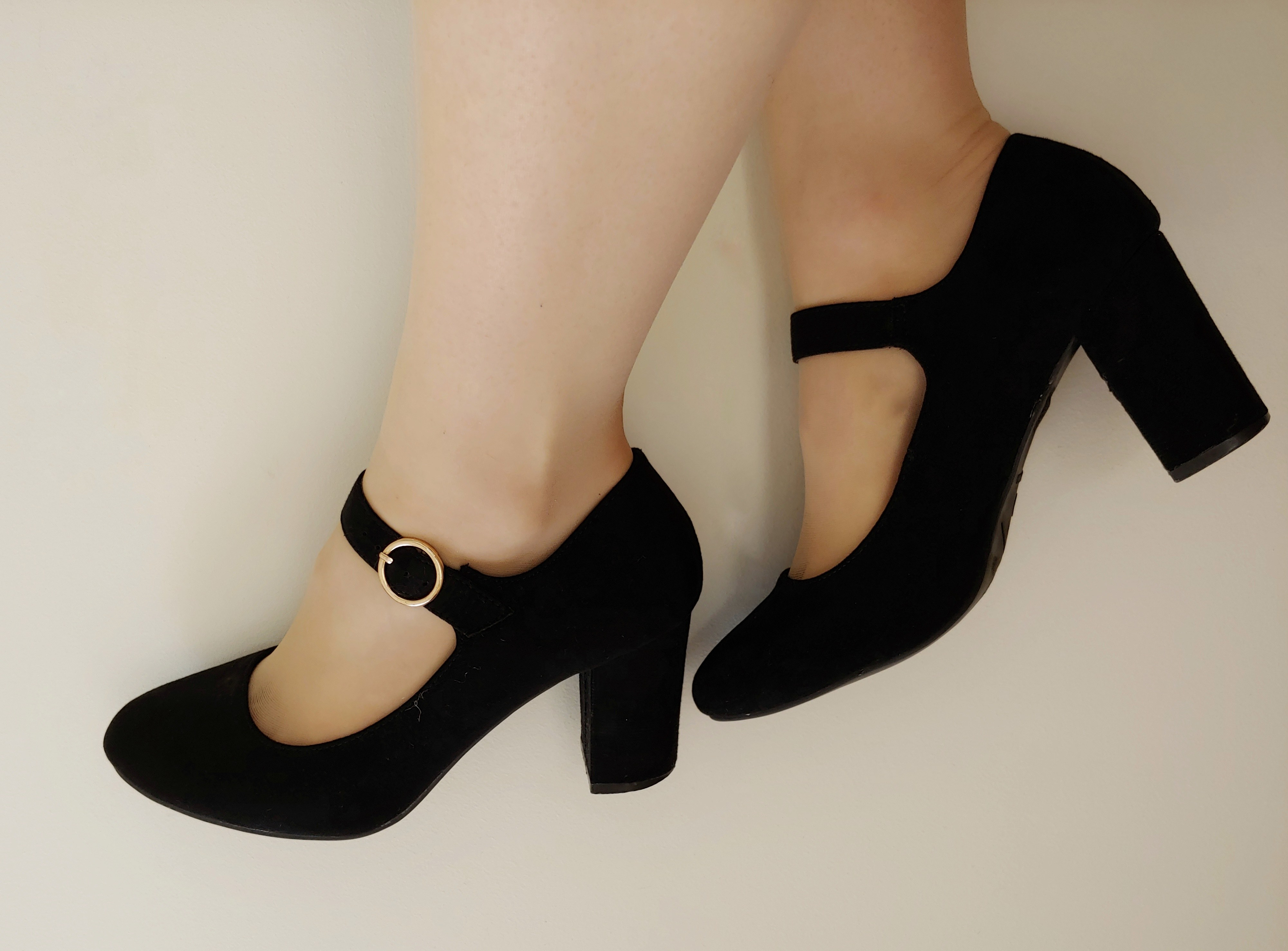 Close-up of Helen wearing black high block-heeled Mary Jane shoes with