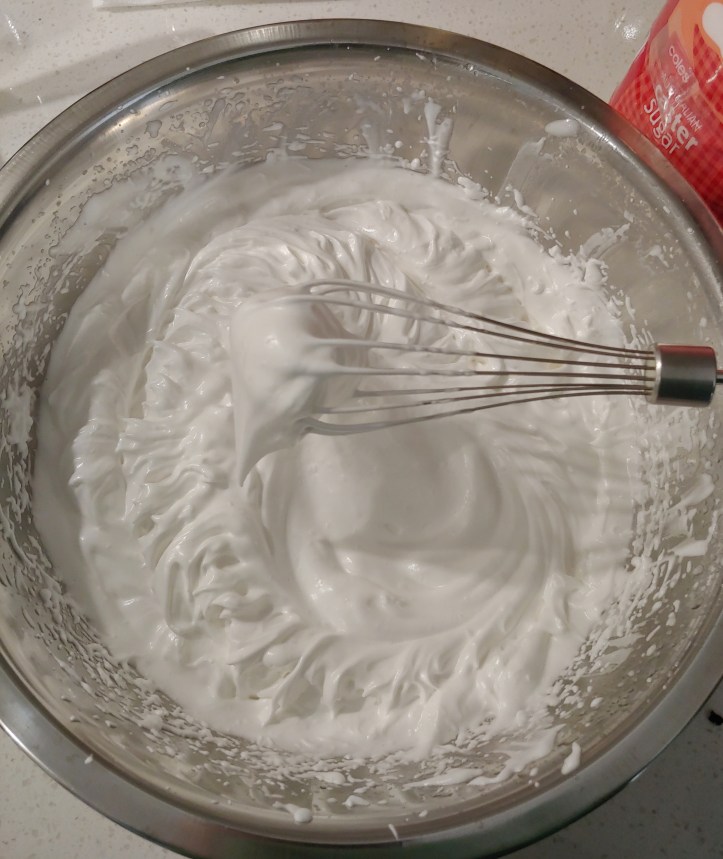 Image of the whipped aquafaba with stiff peaks.