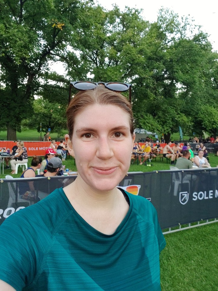 Helen wearing sports gear after a running race looking very sweaty and pink in the face.