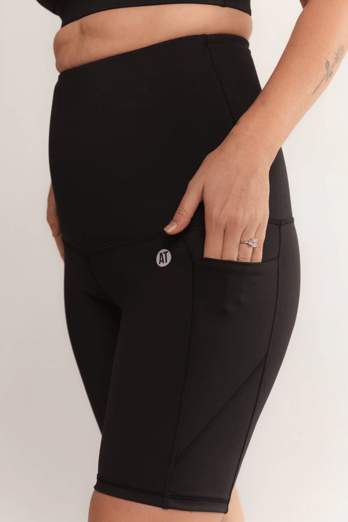 Knee-length black bike shorts with a side pocket.